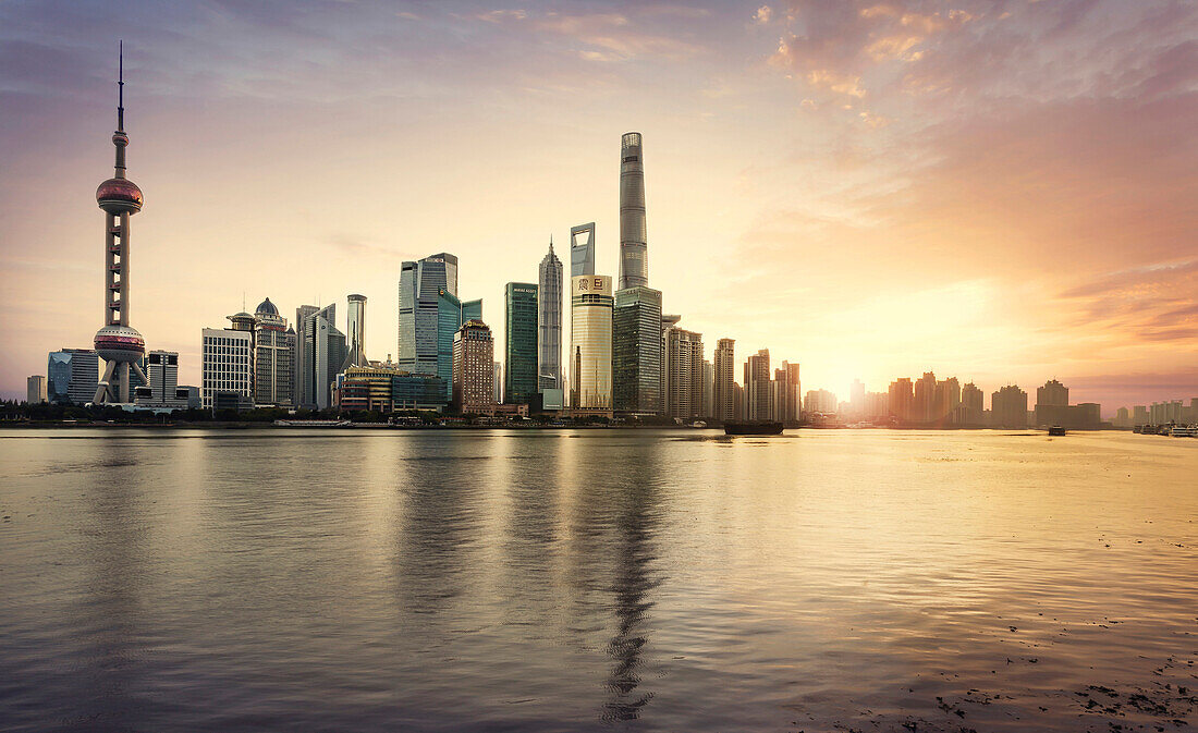 Shanghai city skyline reflecting in waterfront, Shanghai, China