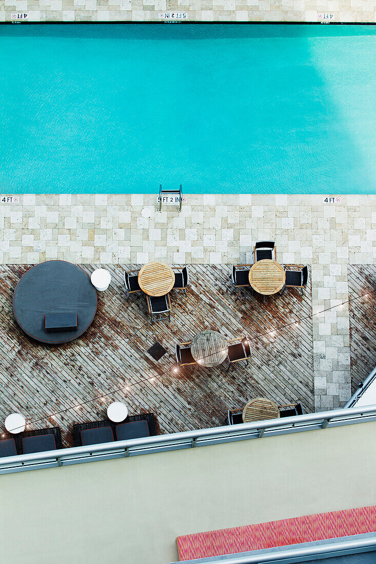 High angle view of tables at hotel swimming pool