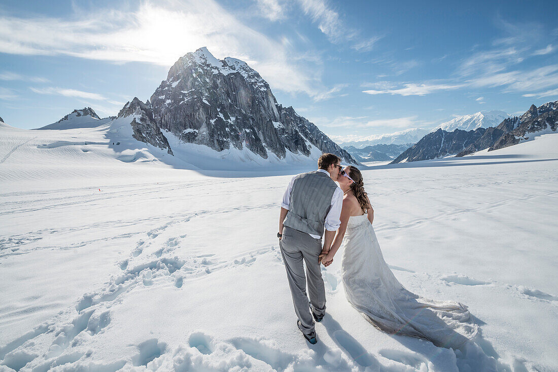 Adventurous bride and groom get married on a glacier in Denali National Park.
