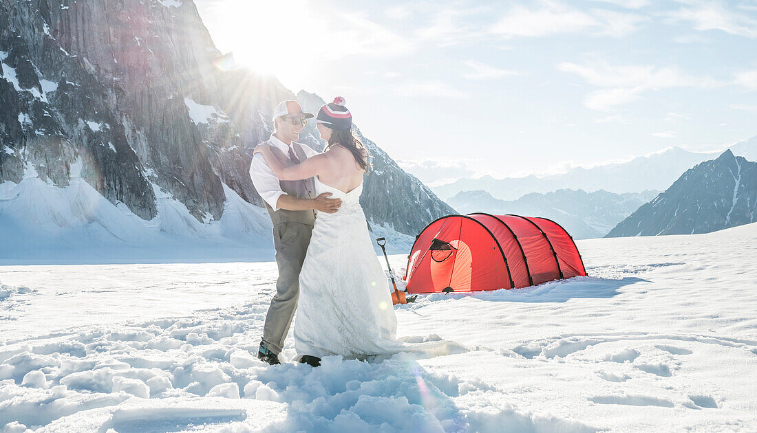 A bride and groom in the mountains of Alaska.