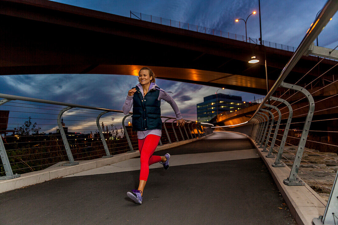 Woman Sprinting at Sunset