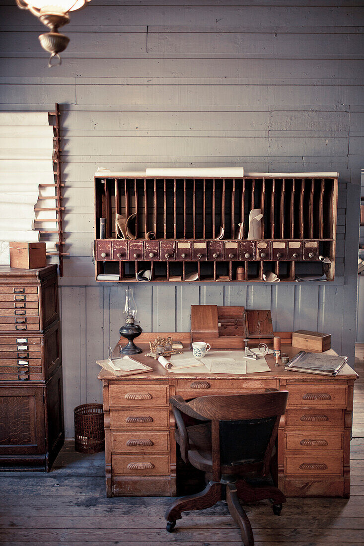 Antique desk and mail slots.