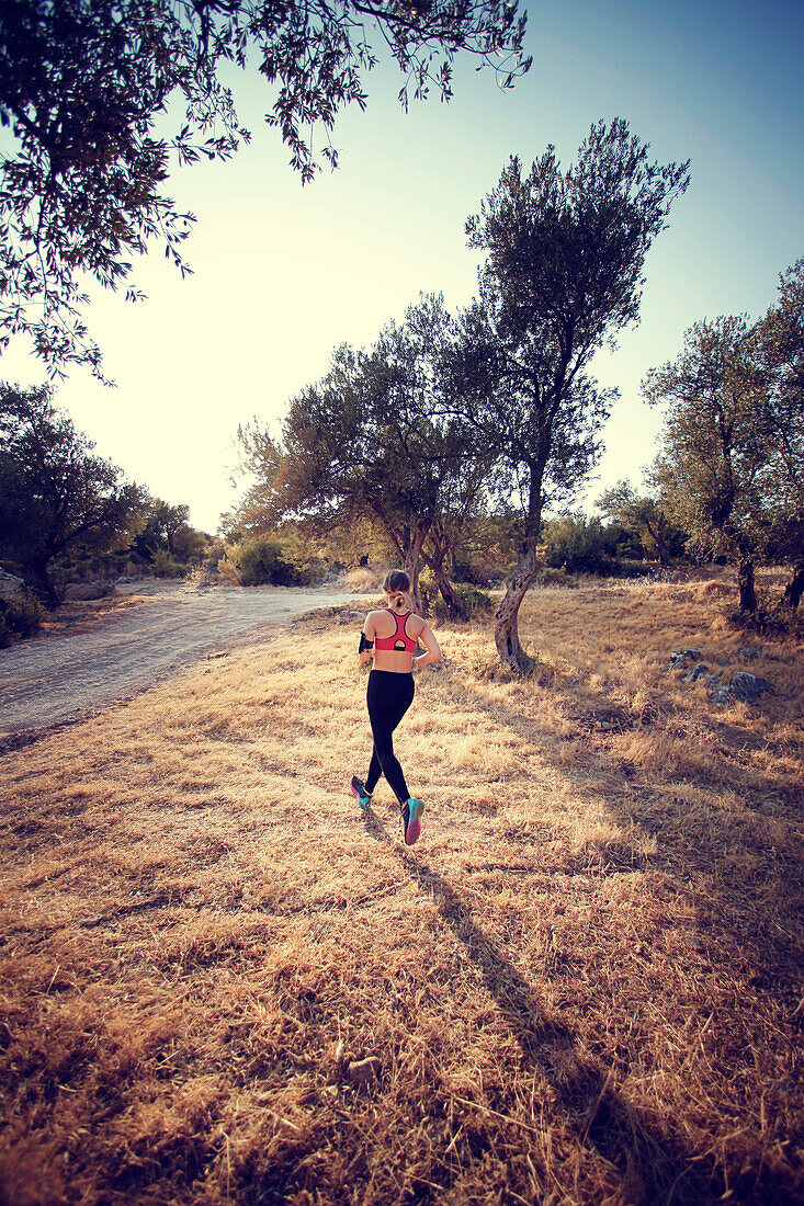 Woman running in forest, Antalya Ka? Turkey