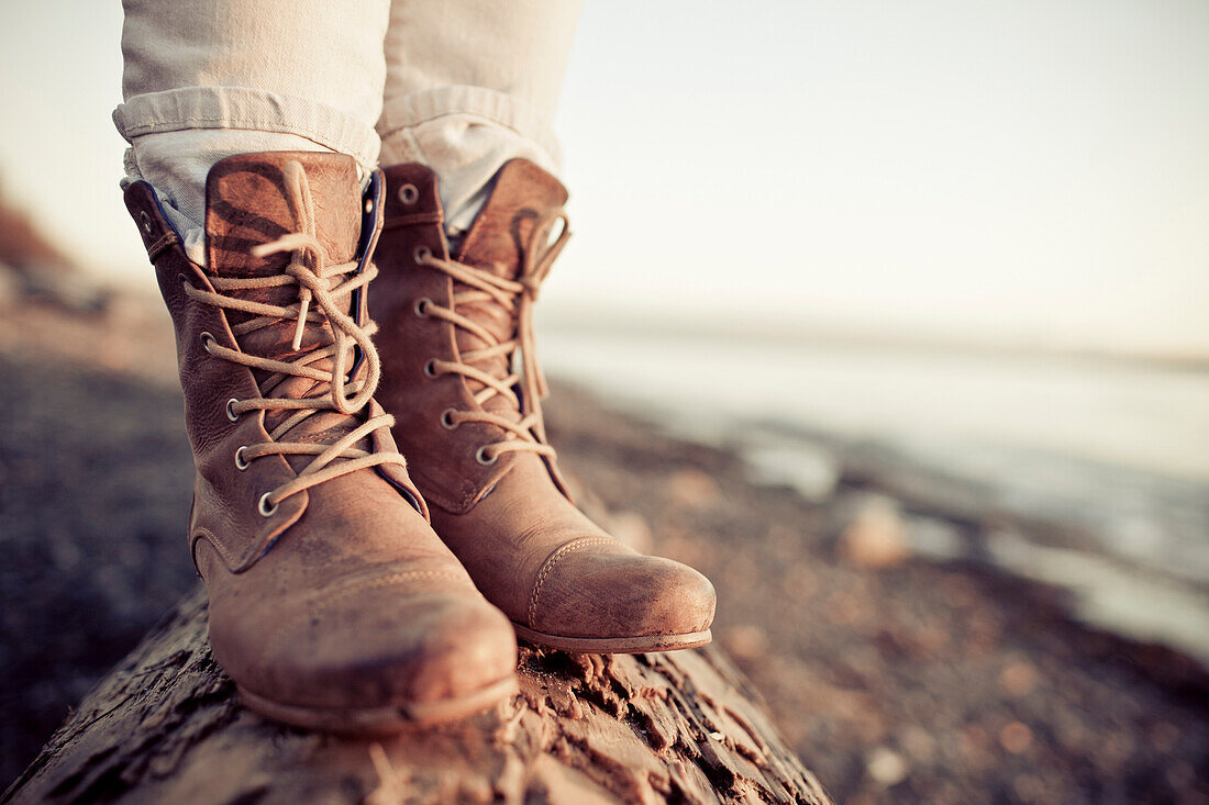 Close up of a young woman's leather boots during a trip to White Rock Beach, British Columbia, Canada.