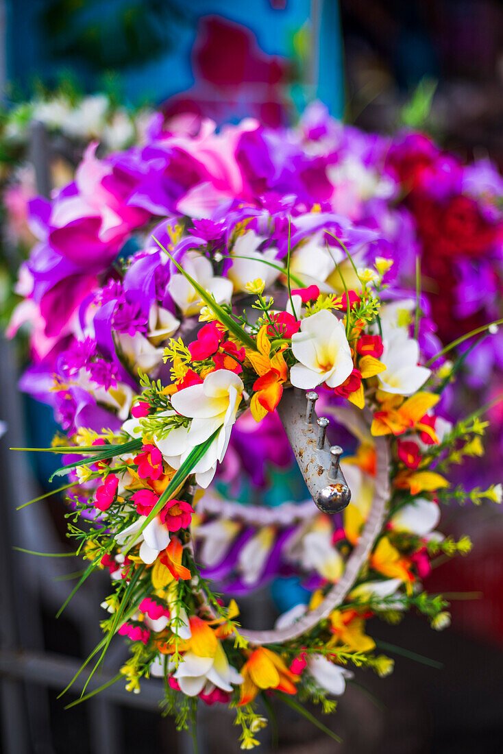 Lei necklace of flowers for sale at Rarotonga Saturday Market Punanga Nui Market, Avarua Town, Cook Islands, South Pacific, Pacific