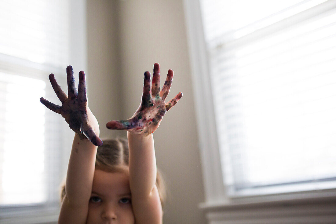 Caucasian girl finger painting