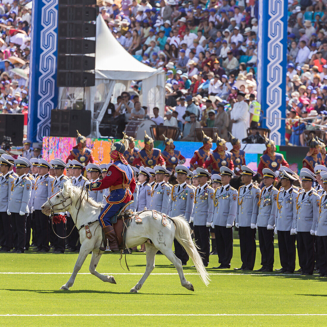 Horseman rides past rows of soldiers, Naadam Stadium, Naadam Festival Opening Ceremony, Ulaan Baatar Ulan Bator, Mongolia, Central Asia, . Asia