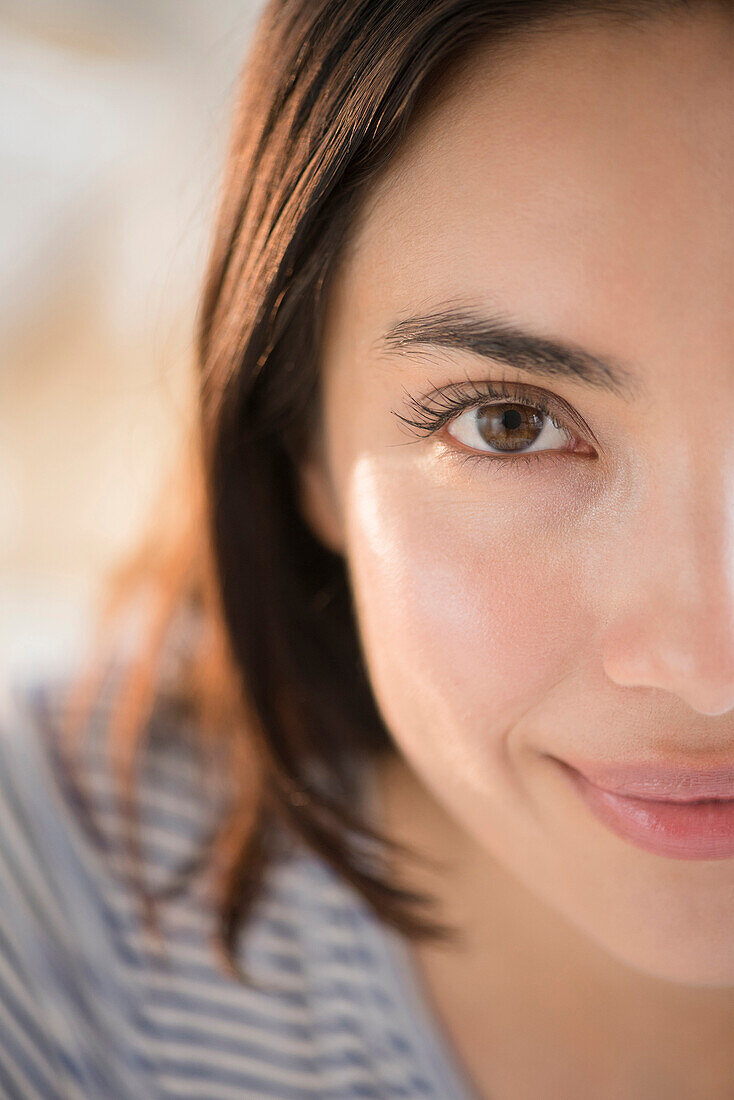 Close up of face of smiling Hispanic woman