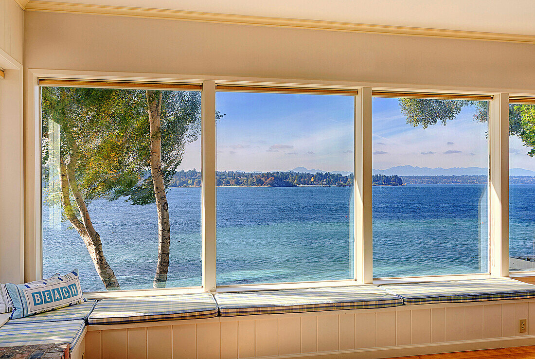 Windows to ocean view in modern living room