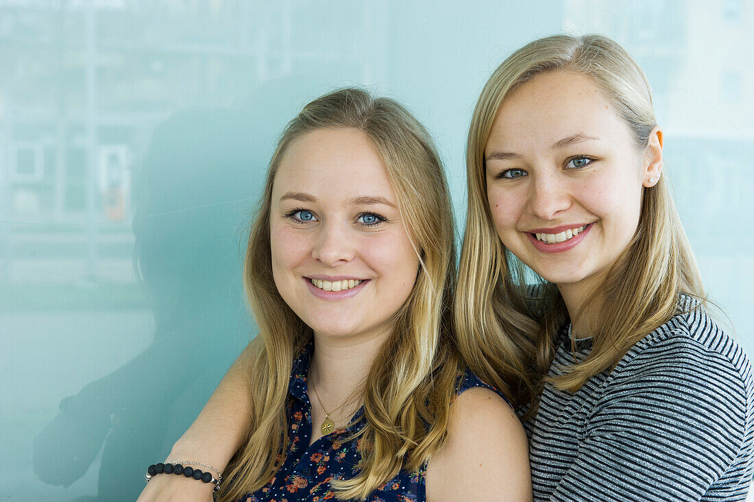 smiling young women, sisters, Germany