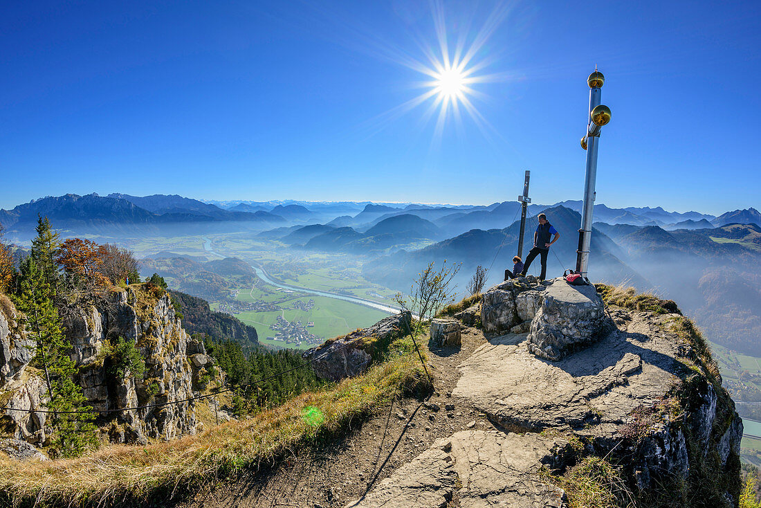 Persons at summit of Kranzhorn, Kaiser range, valley of Inn and Mangfall range in background, Kranzhorn, Chiemgau Alps, Upper Bavaria, Bavaria, Germany