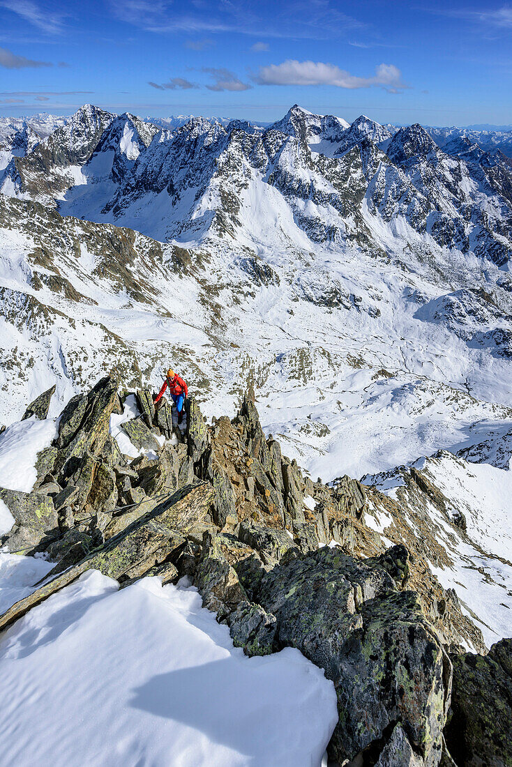 Woman hiking ascending on fixed rope route towards Gloedis, Petzeck in background, Gloedis, Schober Range, High Tauern, High Tauern National Park, East Tyrol, Tyrol, Austria