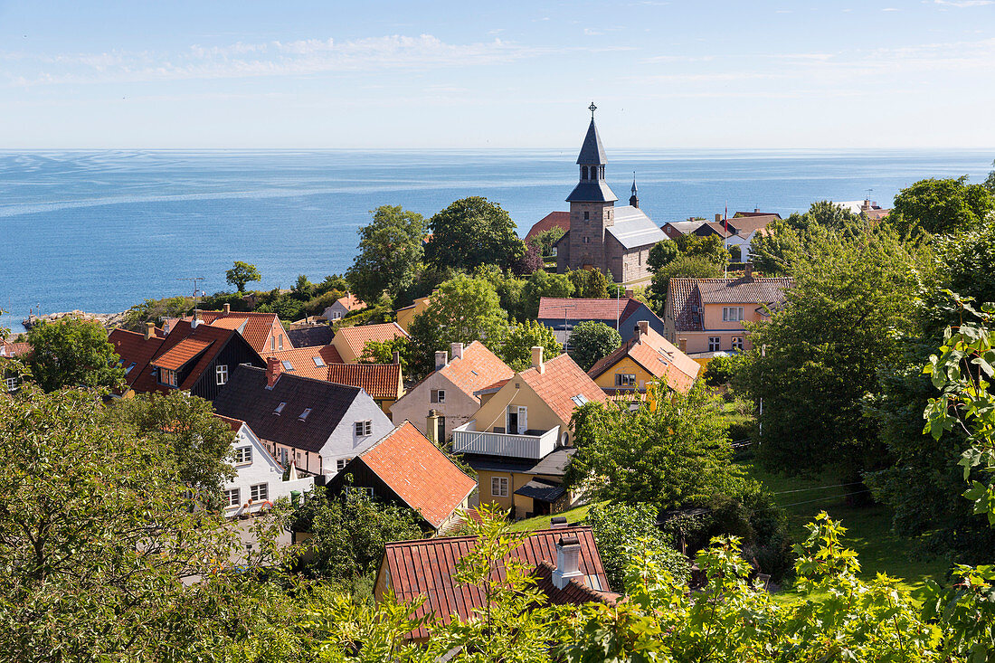 view over the village to the church, coastal landscape, Baltic sea, Bornholm, Gudhjem, Denmark, Europe