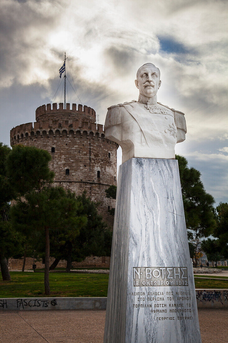White bust of lieutenant Nicholaos Votsis and the White Tower, Thessaloniki, Greece