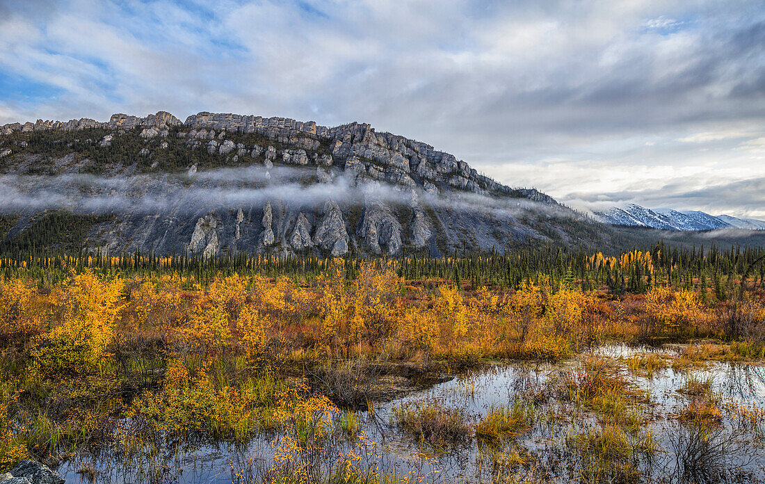 The limestone cliffs of Sapper Hill during autumn along the Dempster Highway, Yukon, Canada