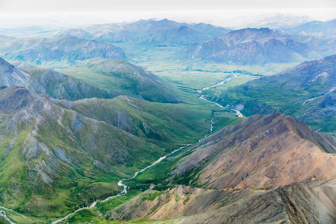 Aerial view of a river cutting through a valley in the Brooks Range, Alaska, United States of America
