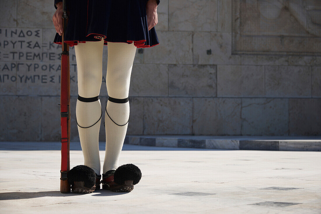 Legs of Greek presidential guardsman with rifle, Athens, Attica, Greece