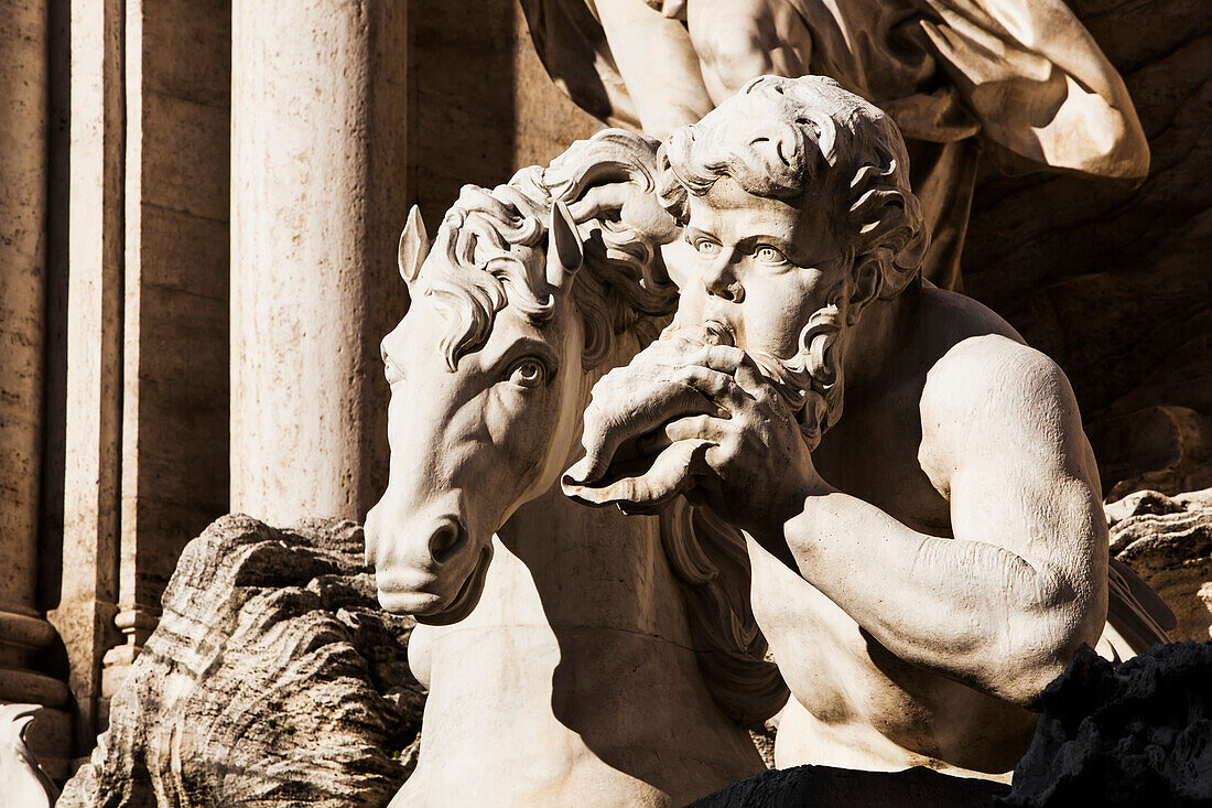 Two giant tritons conduct the winged chariot of Neptune-Ocean, Trevi Fountain, Rome, Italy
