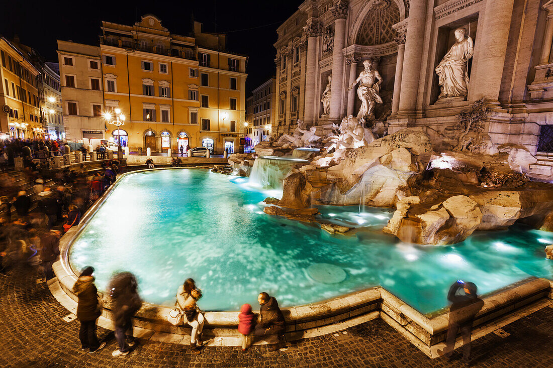Tourists at Trevi Fountain at nighttime, Rome, Italy