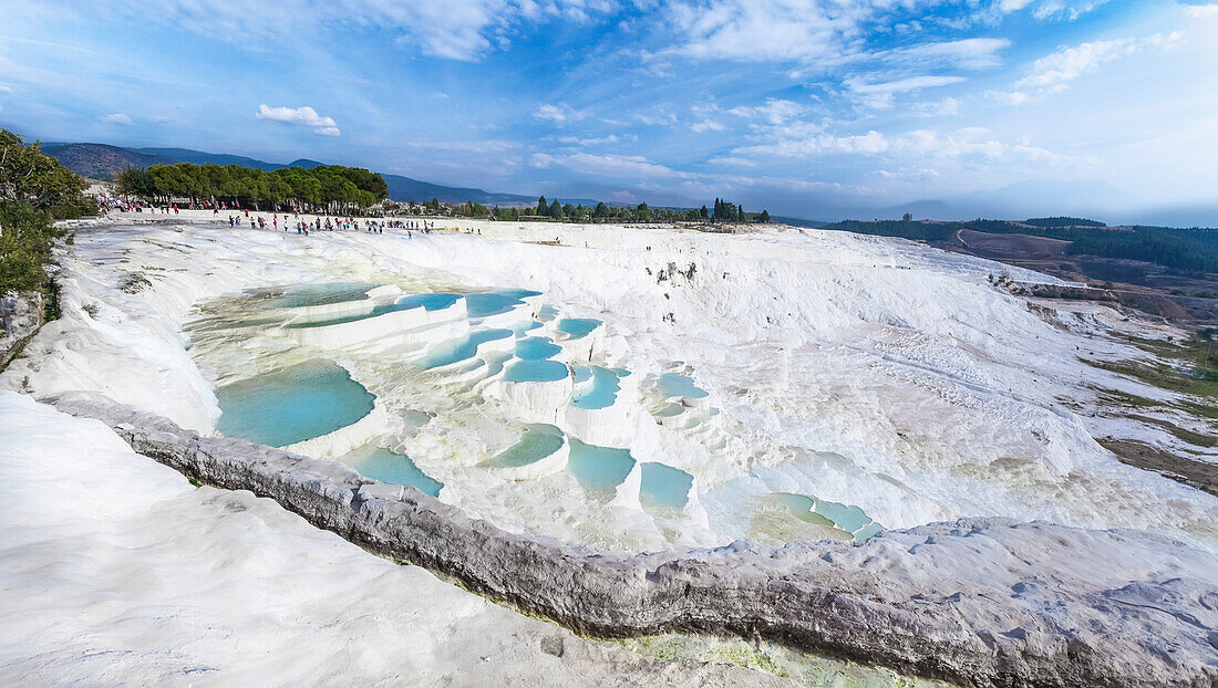 Tourists at the mineral rich pools and hot springs, Pamukkale, Turkey