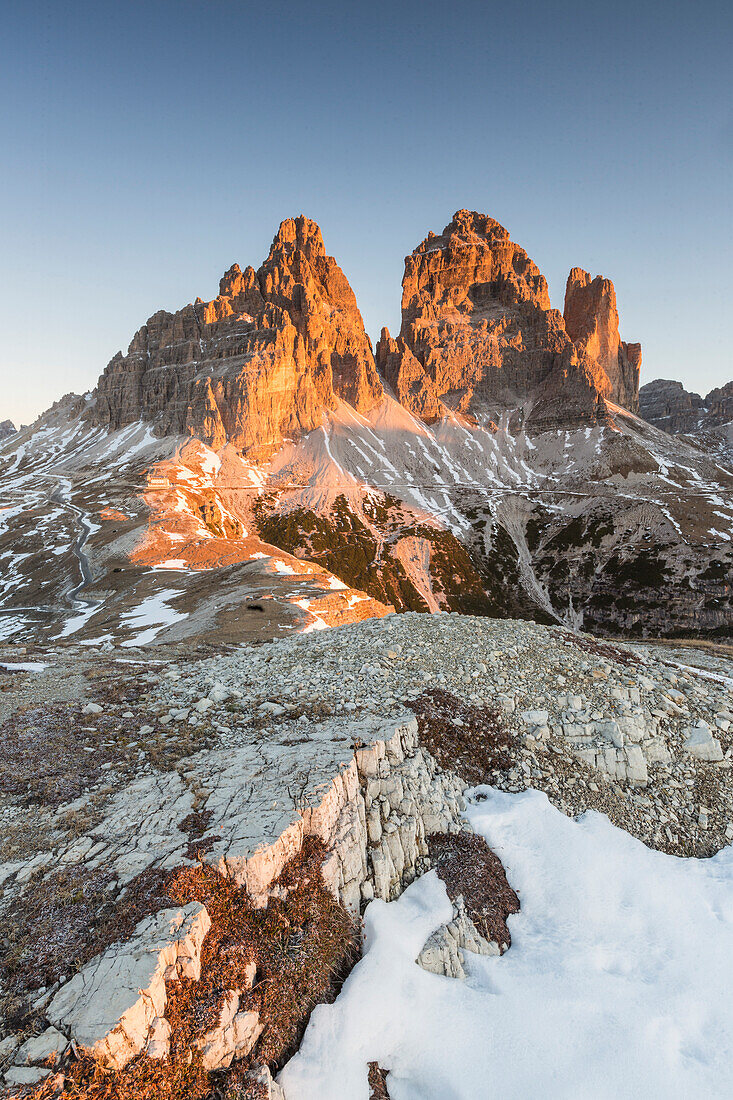 The lights of sunrise frames the Three Peaks of Lavaredo, Dolomites, Auronzo of Cadore, Veneto, Italy, Europe