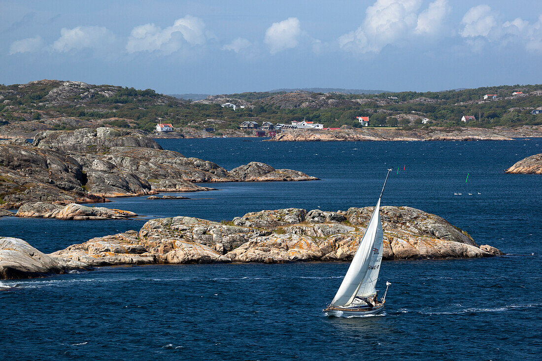 Yacht sailing through islands of archipelago, Skarhamn, Tjorn, Bohuslan Coast, southwest Sweden, Sweden, Scandinavia, Europe