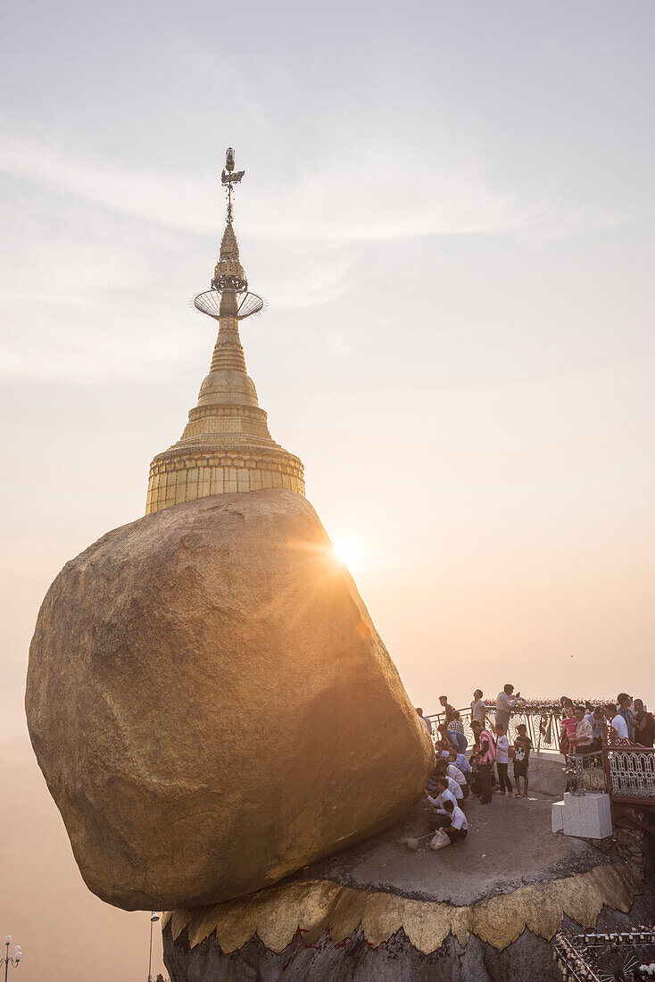 Pilgrims at Golden Rock Stupa Kyaiktiyo Pagoda at sunset, Mon State, Myanmar Burma, Asia
