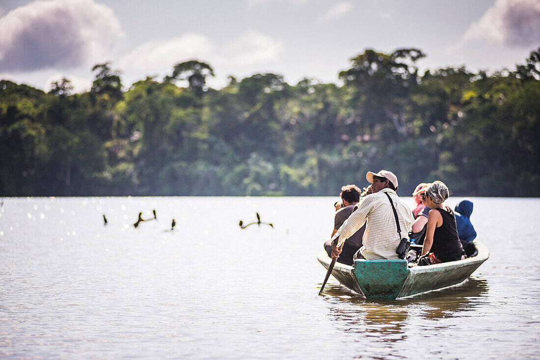 Canoe boat trip in Amazon Jungle of Peru, by Sandoval Lake in Tambopata National Reserve, Peru, South America