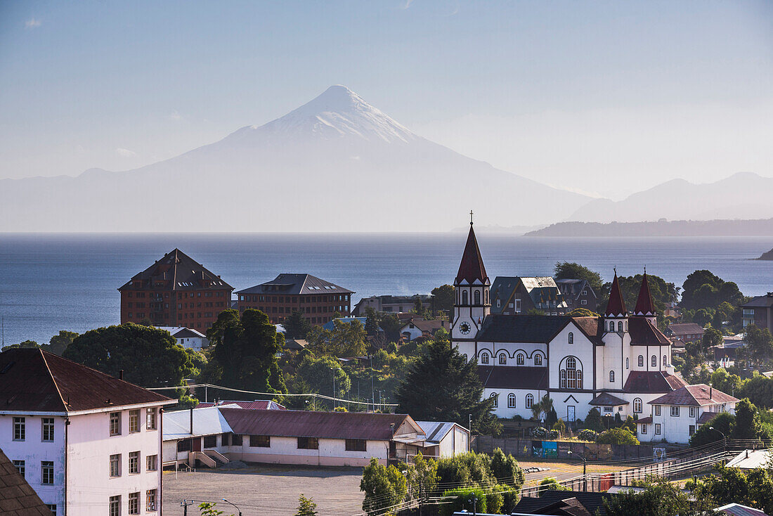 Sacred Heart of Jesus Catholic Church Iglesia Sagrado Corazon de Jesus with Llanquihue Lake and Osorno Volcano behind, Puerto Varas, Chile Lake District, Chile, South America