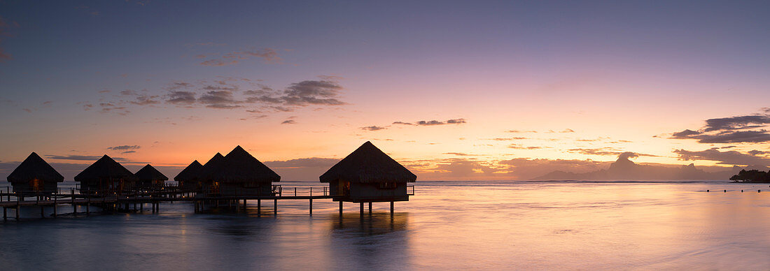 Overwater bungalows at Le Meridien Tahiti Hotel at sunset, Papeete, Tahiti, French Polynesia, South Pacific, Pacific