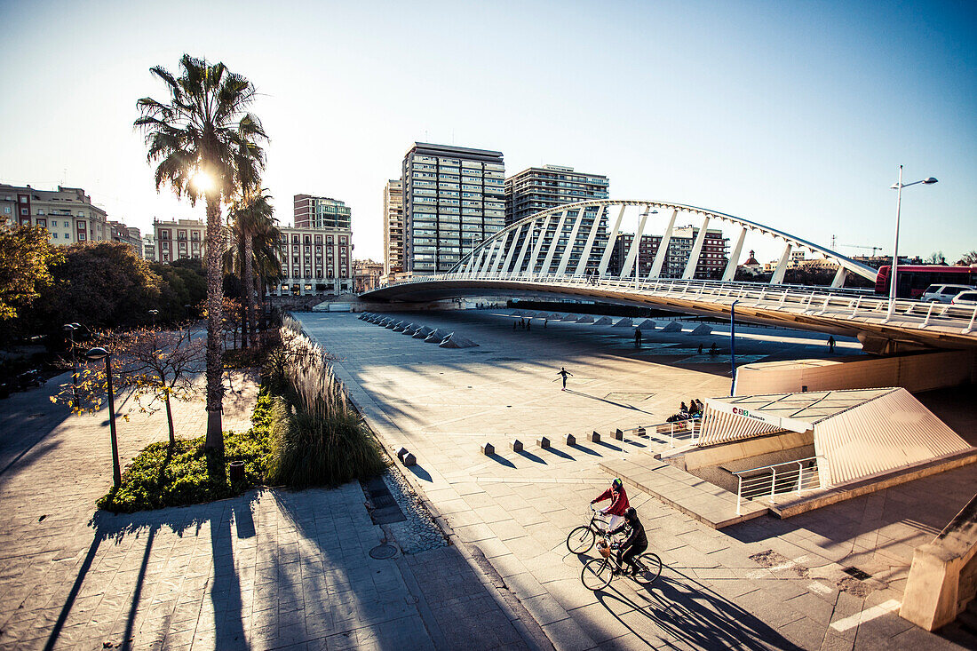 Bridge and city in Valencia, Spain at sunset.