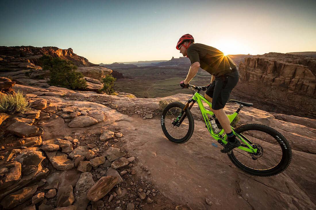 A man mountain biking on the Hymasa trail, Moab, Utah.