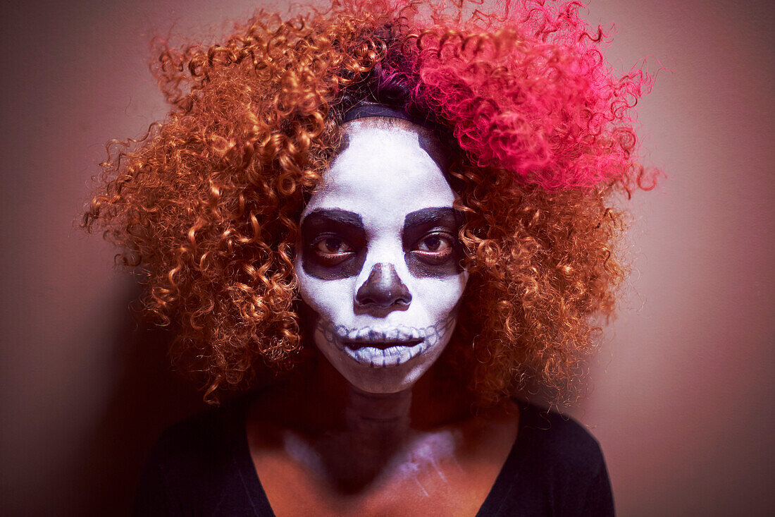 Black woman wearing skull makeup