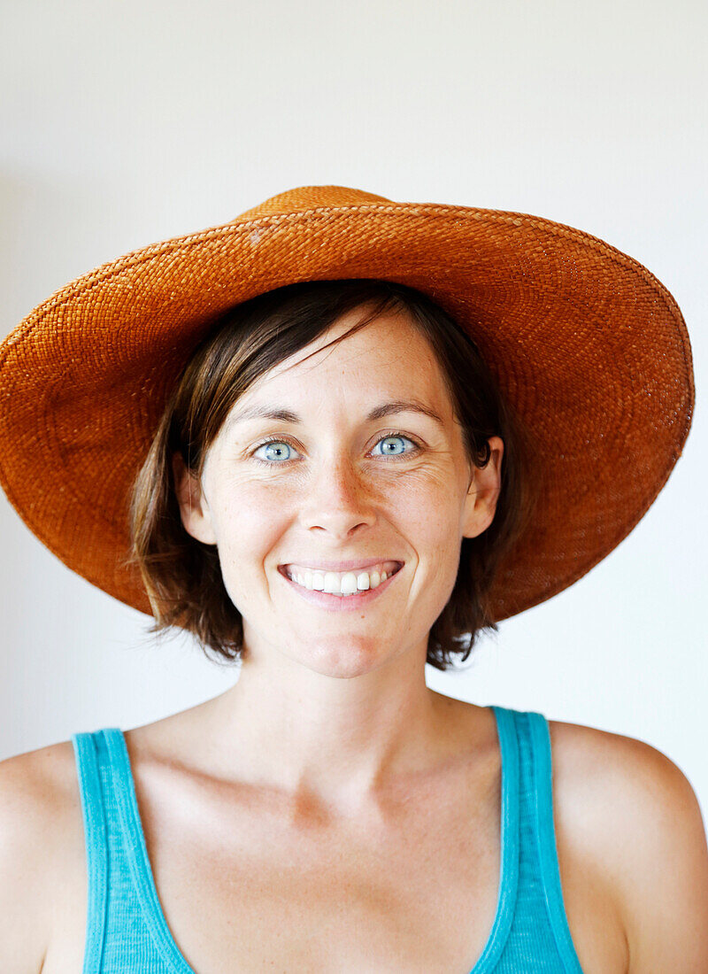 Smiling woman wearing sun hat