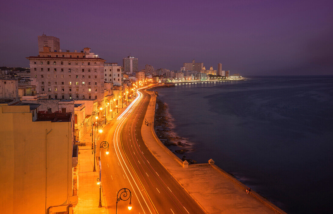 Long exposure of cars on waterfront at night, Havana, Cuba