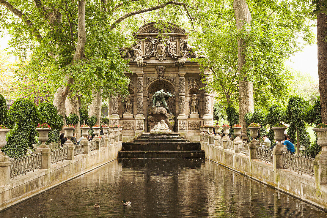 Ornate statue over park stream