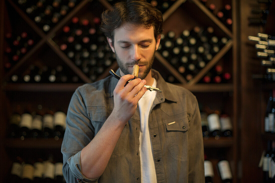 Sommelier smelling wine cork