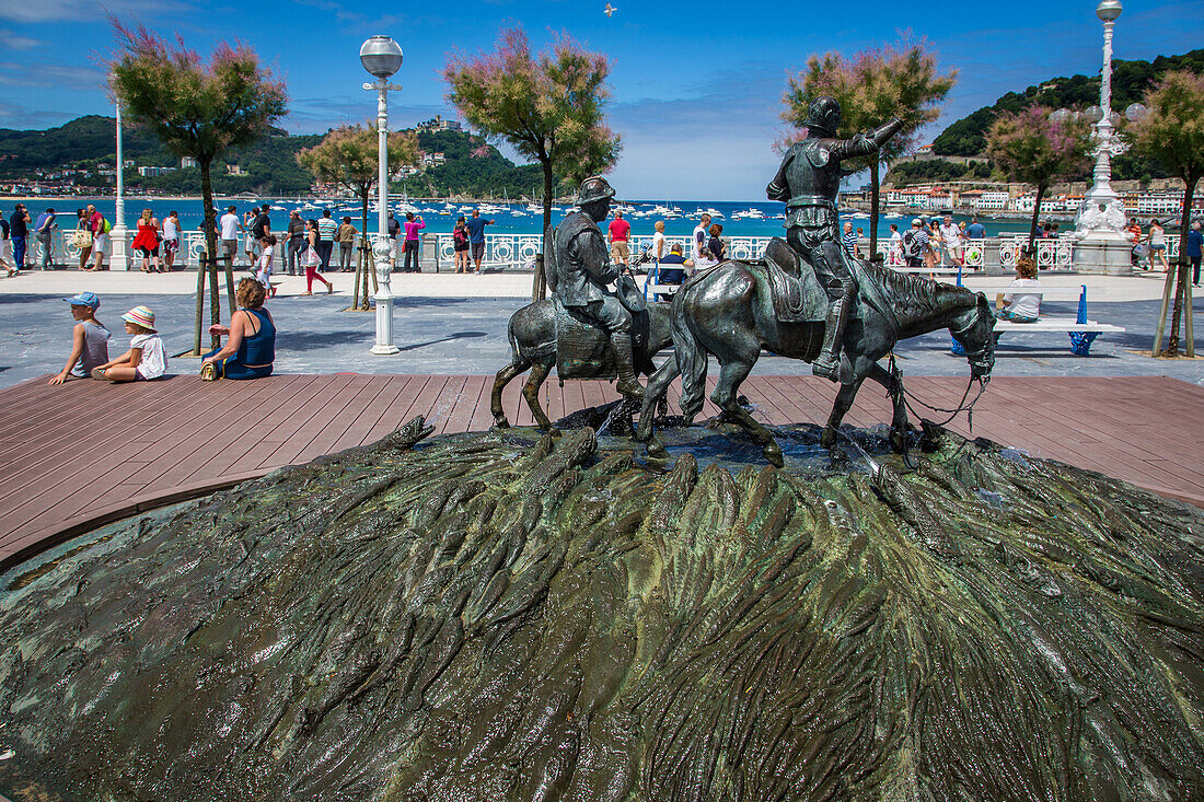 promenade on the la concha beach and sculpture of don quixote and sancho panza, san sebastian, basque country, spain