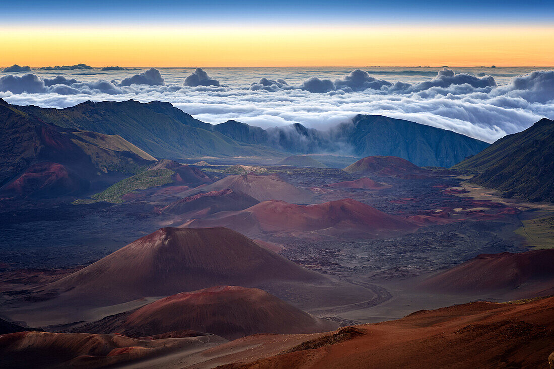 haleakala at sunrise, clouds pouring into the crater, maui, hawaii, united states, usa