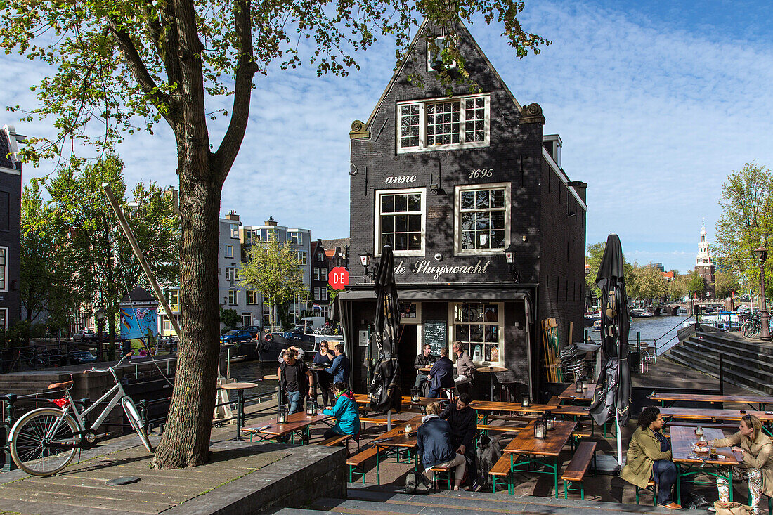 terrace of the sluyswacht cafe dating from 1695, jodenbreestraat, amsterdam, holland