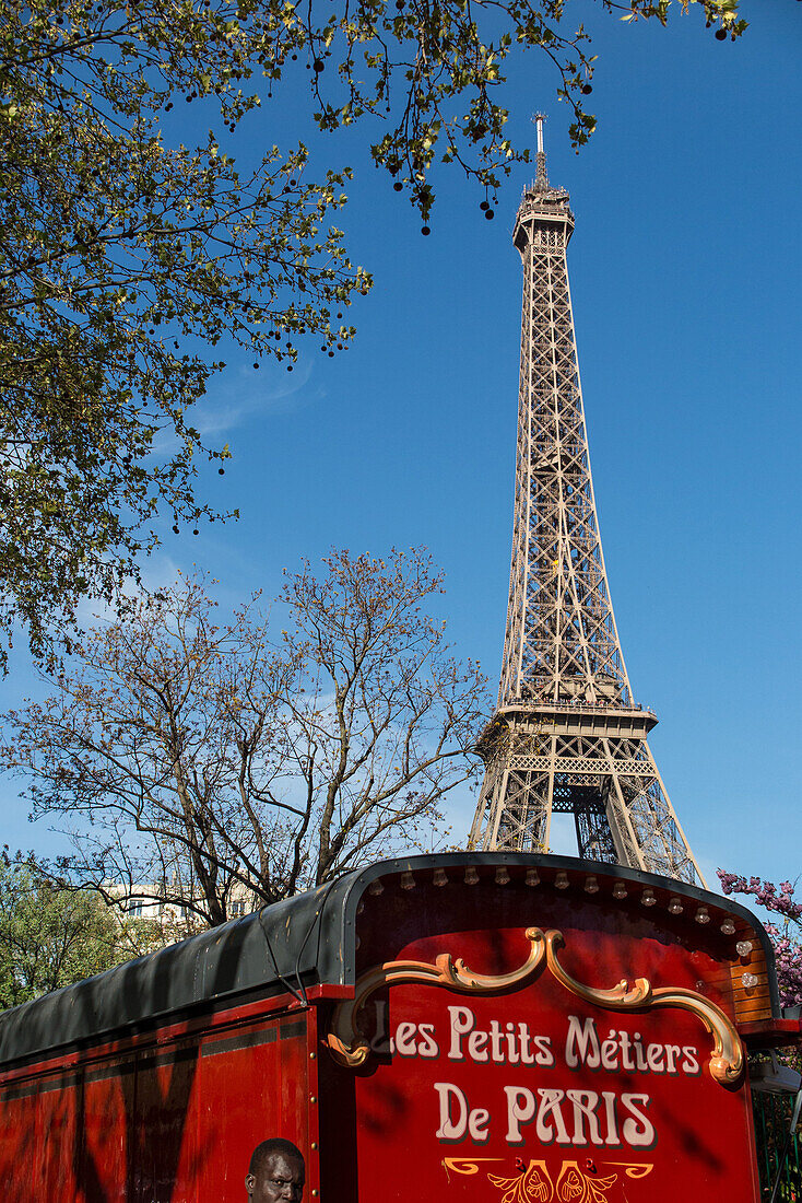 caravan of the small trades of paris in front of the eiffel tower, 16th arrondissement, paris (75), france