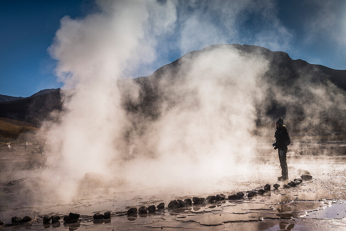 Tourist at El Tatio Geysers Geysers del Tatio, the largest geyser field in the Southern Hemisphere, Atacama Desert, Chile, South America