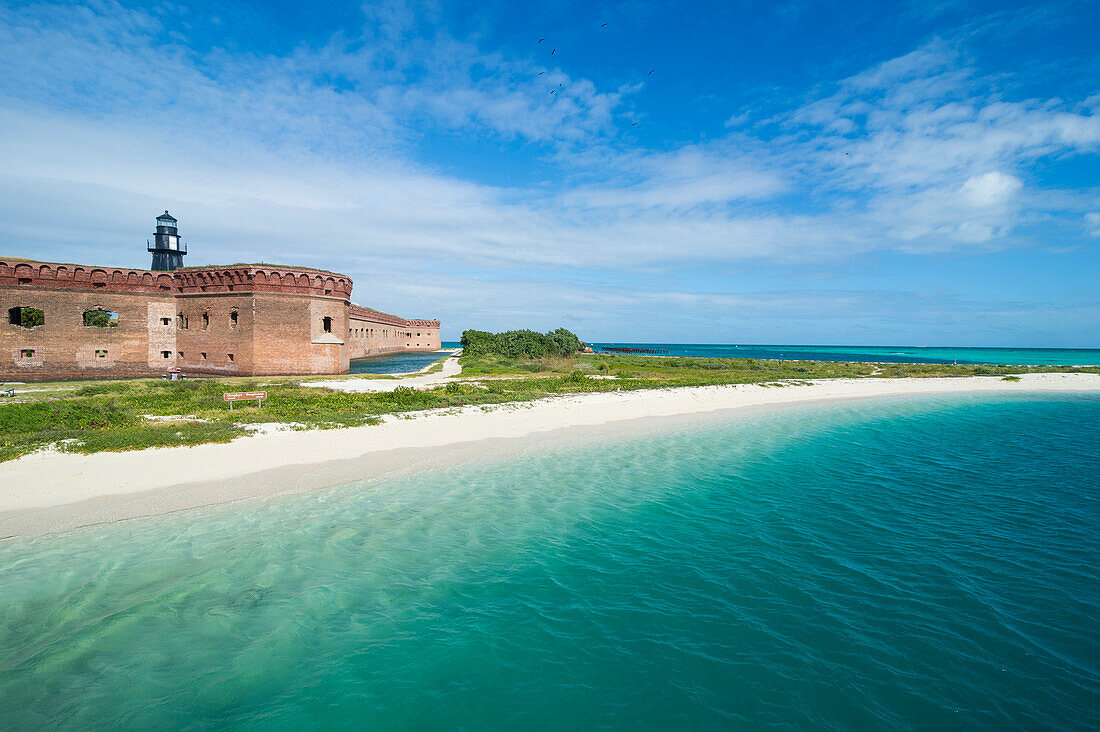 Turquoise waters and white sand beach in front of Fort Jefferson, Dry Tortugas National Park, Florida Keys, Florida, United States of America, North America