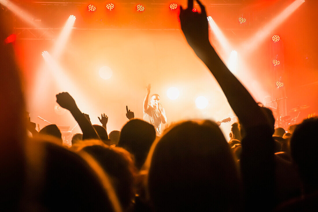 Male singer performing in front of audience