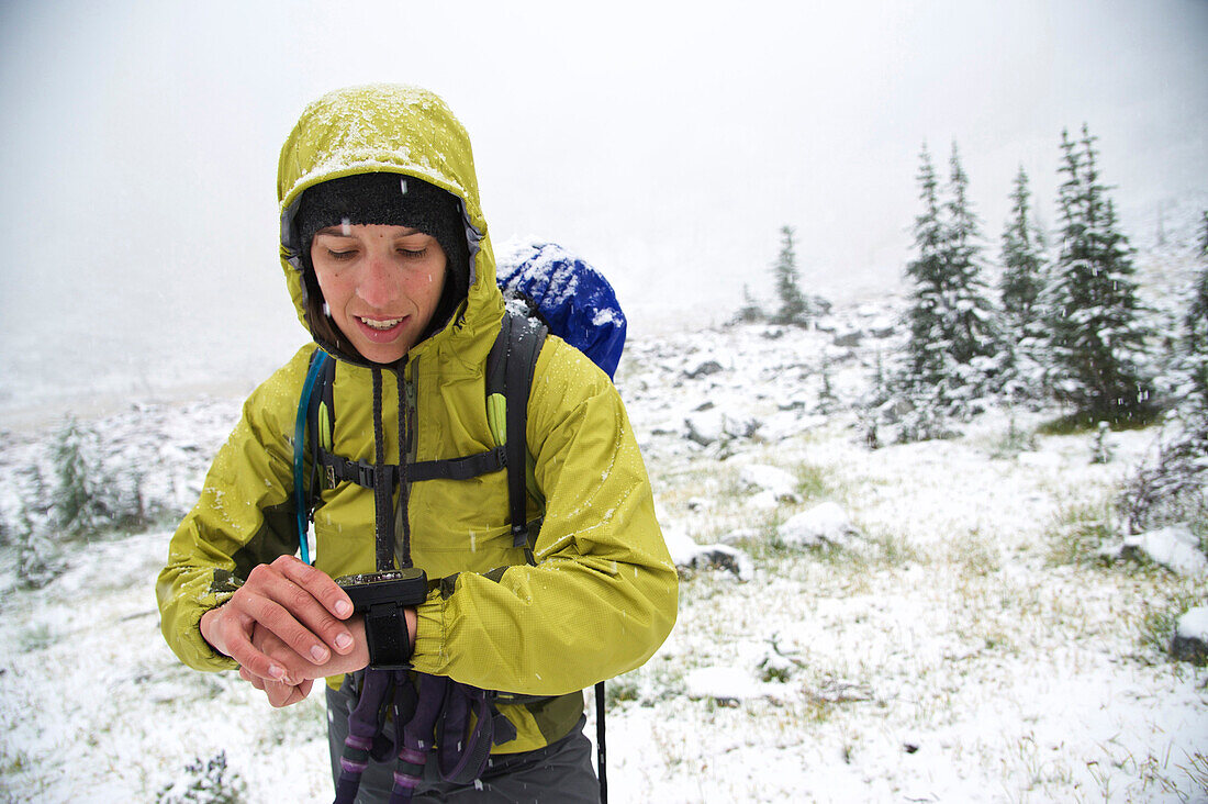 Woman navigates her way as early winter snow covers the trail in the Glacier Peak Wilderness outside of Leavenworth, Washington September 2011.  This 14-mile loop in the Entiat Mountains starts at the Phelps Creek trailhead leads up to Upper Ice Lake via 