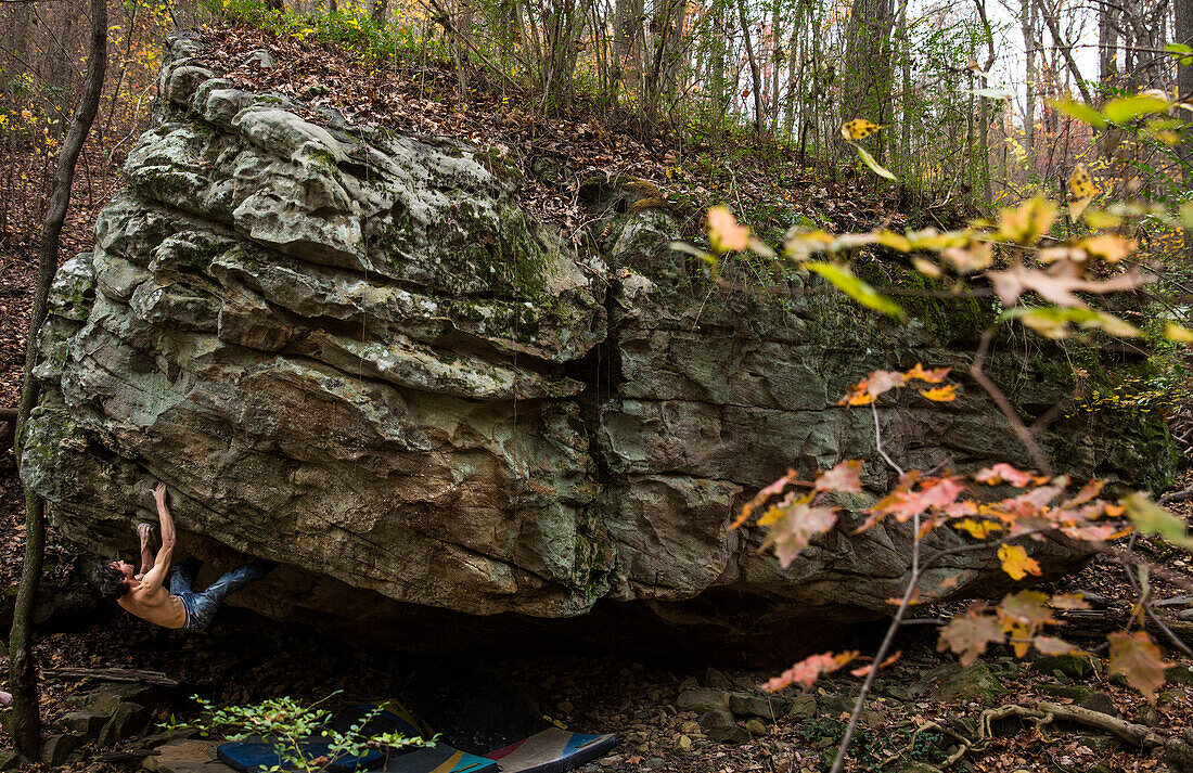 Strong boulderer. climbing on a roof outside in Chattanooga, Tennessee