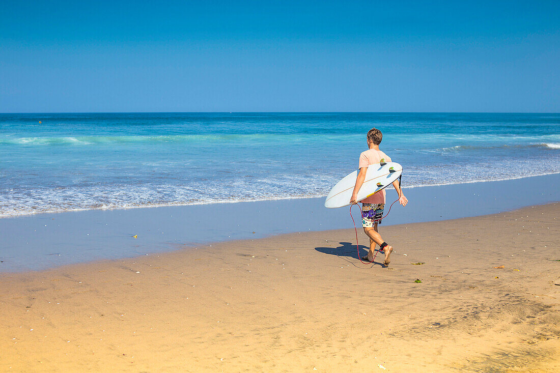 Surfer on a beach.