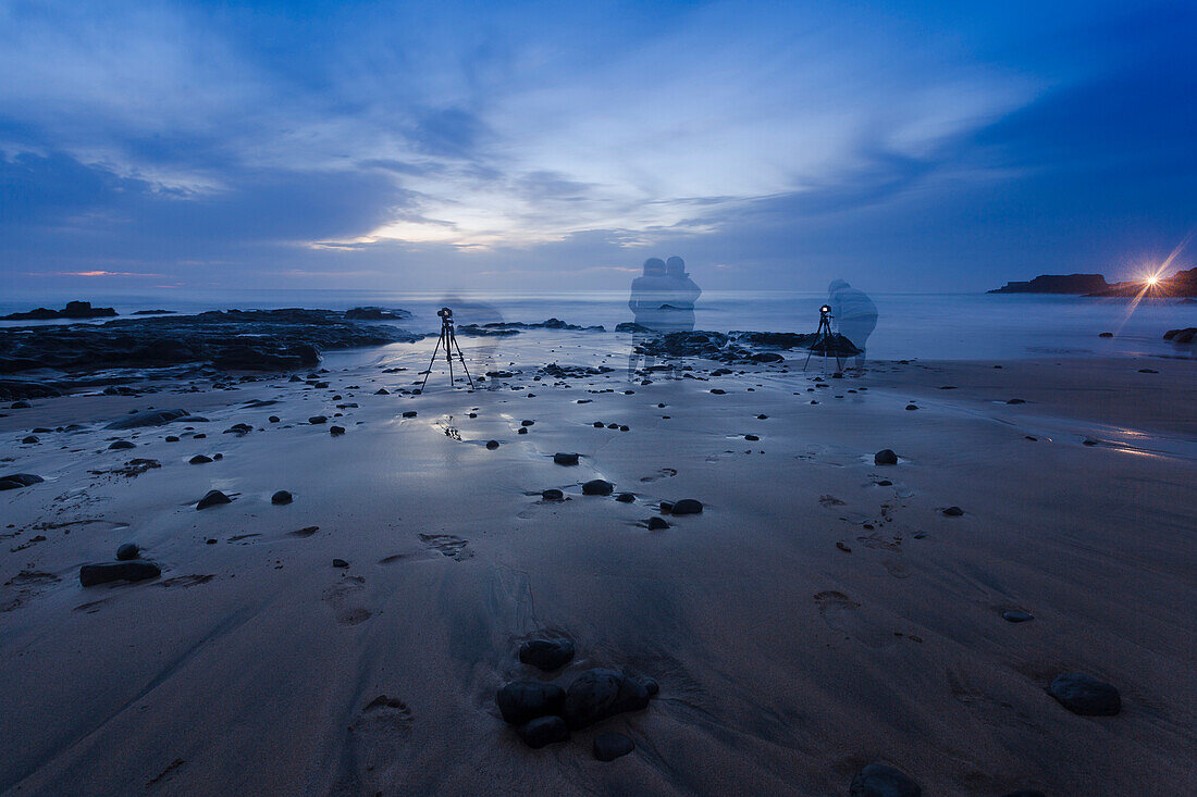 Photographers on the beach at dawn [long exposure]