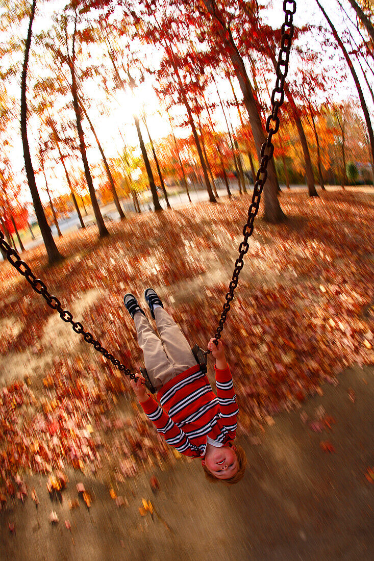 Swing-mounted remote camera captures a blur motion image of Will Chouinard on the swing at the Town Park in Fayetteville, WV