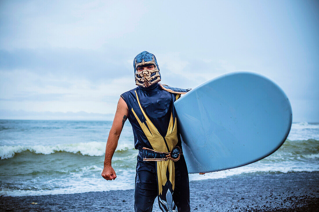 Surf in a carnival costumes, Bali, Indonesia.  Just take a fun and play with a friends.